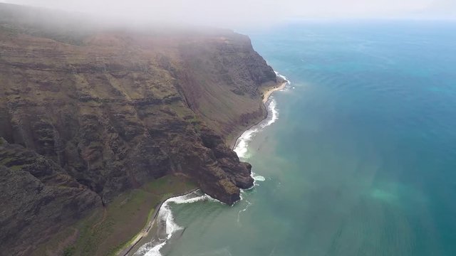 POV flying airplane. Garden Isle. Waimea Canyon State Park and Na Pali coast. Volcanic mountain geology. Economy is tourism based.