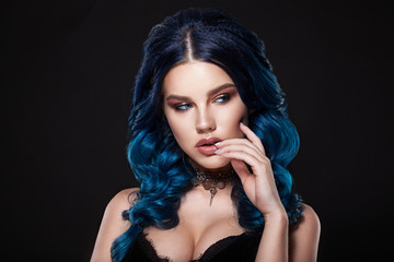 Fototapeta premium Beauty face of a girl with blue hair with a braid hair.