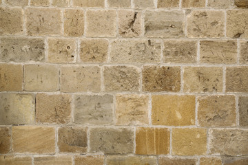 old stone wall of an ancient building