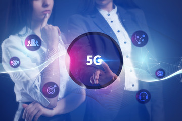 The concept of business, technology, the Internet and the network. A team of business women working on the virtual screen of the future and see the inscription: 5G