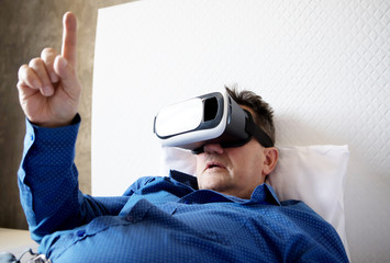 Senior man with virtual headset or 3d glasses.