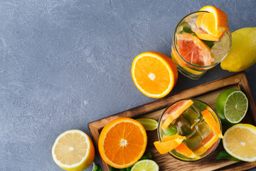 Colorful summer background with citrus drinks and fruits