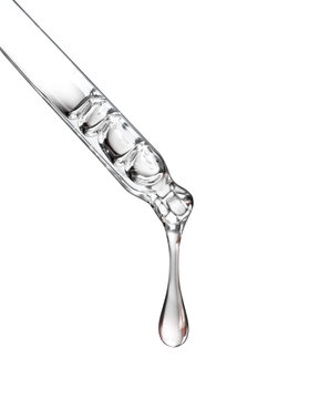 Cosmetic pipette with a drop close up on white background