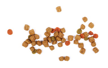 Dry dog food isolated on white background, top view