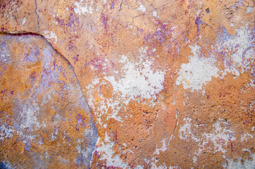 Old wall with cracked paint, orange