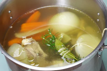  making chicken soup stock (bouillon) in a pot   © uckyo