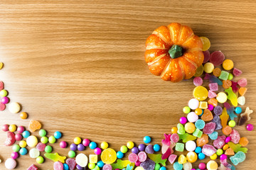 colorful halloween candy dessert party on wood ground