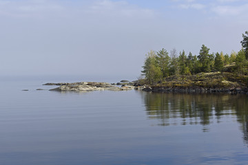 The haze over the lake. Karelia, Russia.