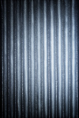 Cold blue corrugated metallic texture industrial abstract pattern background with ridges