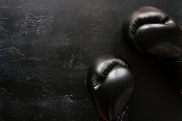 boxing gloves on a black background with space for text