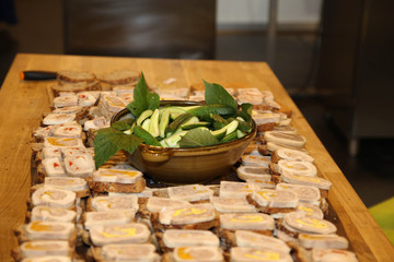 Canape with meet on the wooden board 