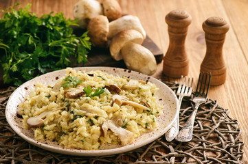 Homemade risotto with boletus and parsley.