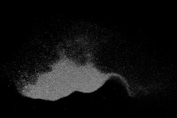 Powder explosion isolated on black background, abstract dust overlay texture, clipping path, top...