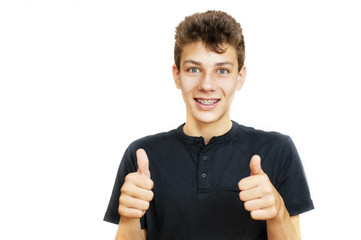 A handsome guy shows the class with two big fingers. He has braces on his teeth
