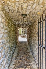 Obraz premium Lower old town with cobblestone street narrow alley called Passage De La Batterie with light lamp