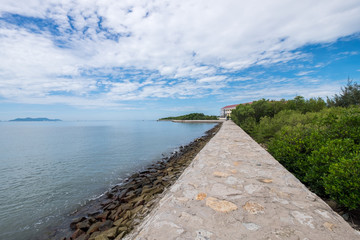 Fototapeta na wymiar Scenery of the sea from a harbour in Can Gio, Vietnam. Can Gio is a small and peaceful town near Ho Chi Minh city, located in South of Vietnam, Can Gio is famous for its landscape view and seafood