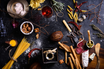 Appetizersalami and pasta.Italian cuisine ingredients.Top view.