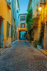 Fototapeta premium Narrow street in the old town Antibes in France. Night view