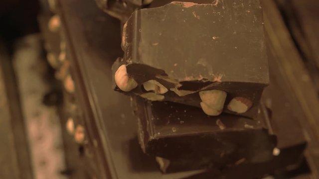 Piece of chocolate close up. Sweet food macro. Calories in dark chocolate.