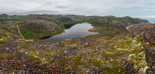 Lake with clean, fresh water on the shore of the Barents sea. Kola Peninsula , Russia.
