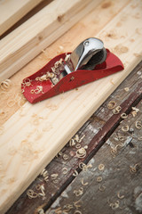 jack-plane on wood chips boards on a workbench