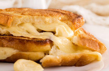 Italian toast sandwich with white bread and mozzarella cheese fried in oil. Mediterranean meal.