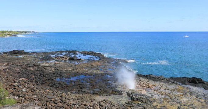 Kauai Hawaii Spouting Horn Park blowhole ocean. Kauai is the oldest Hawaiian Island. Garden Isle. Economy is tourism based. Water and tropical beach recreation and fun. Beautiful blue ocean sea.