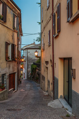 Fototapeta na wymiar Narrow street in the old town at night in Italy