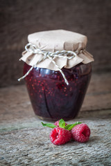 Raspberry jam with fresh raspberries