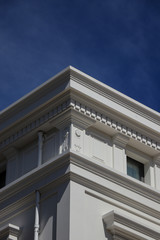 Fototapeta na wymiar Geometric Corner of a white building against the sky