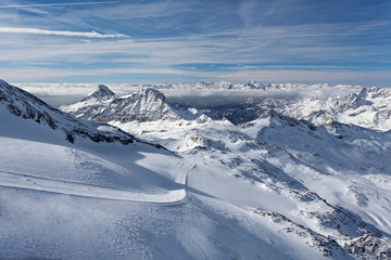 Mountain skiing - panoramic view from Plateau Rose at the ski slopes and Cervinia, Italy, Valle d'Aosta, Breuil-Cervinia, Aosta Valley, Cervinia - 175117409