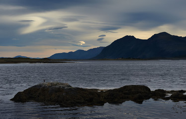 Fototapeta na wymiar Sea landscape with mountains and gloomy sky, Lofotens, Norway