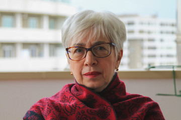 A portrait of a white-haired lady