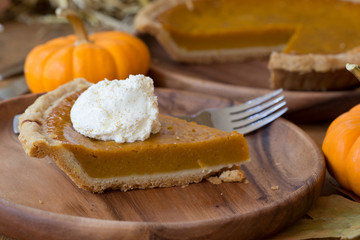 Slice of Pumpkin Pie With Whipped Cream Topping