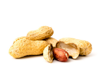 A peanut in a peel and peeled on a white