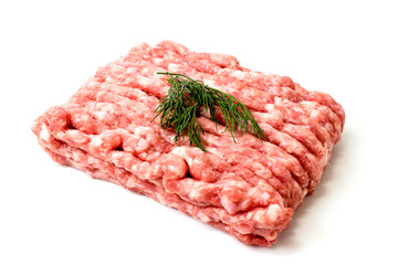Minced meat with herbs on a white