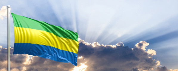 Gabon flag on blue sky. 3d illustration