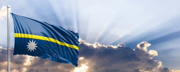 Nauru flag on blue sky. 3d illustration