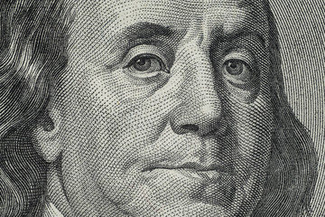 Close up on US dollar banknotes.  Portrait of Franklin on US dollar Banknotes. Shooting by 1:1...
