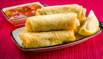 Spring rolls, chopsticks and sauce