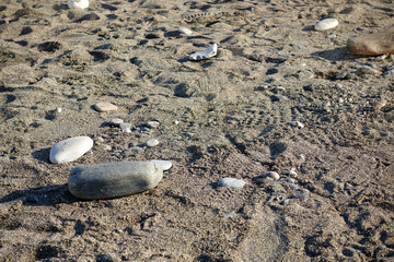 Stones on sand