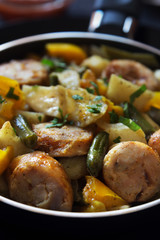 Fried potatoes with sausages macro