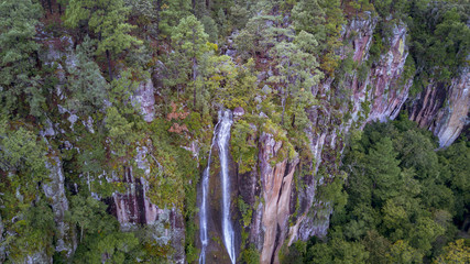 aerial of high waterfall in the forest
