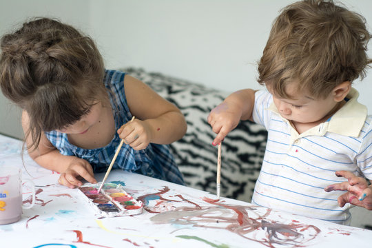 Children Playing And Painting At Home Or Kindergarten Or Playschool