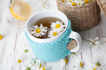 Fototapeta na wymiar Cup of chamomile tea