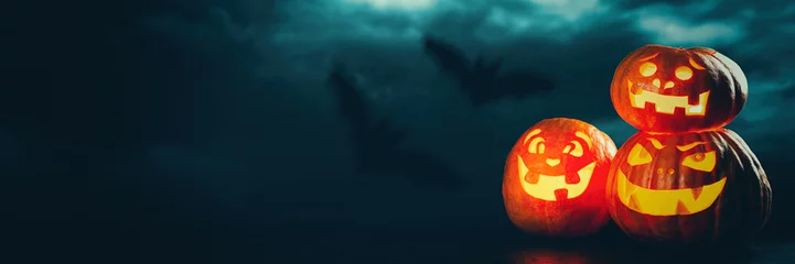 Rolgordijnen Three halloween Jack O' Lantern pumpkins © George Dolgikh