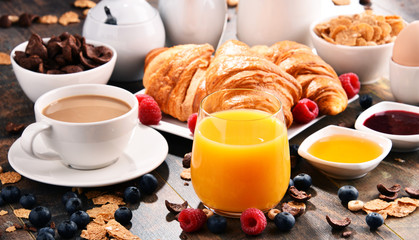 Breakfast served with coffee, juice, croissants and fruits