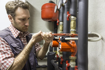 plumber at work installing a circulation pump