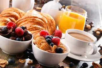 Breakfast served with coffee, juice, croissants and fruits