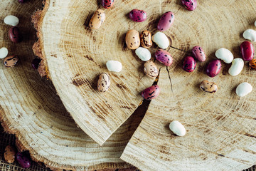 Beans on a wooden background are full of protein and vitamins